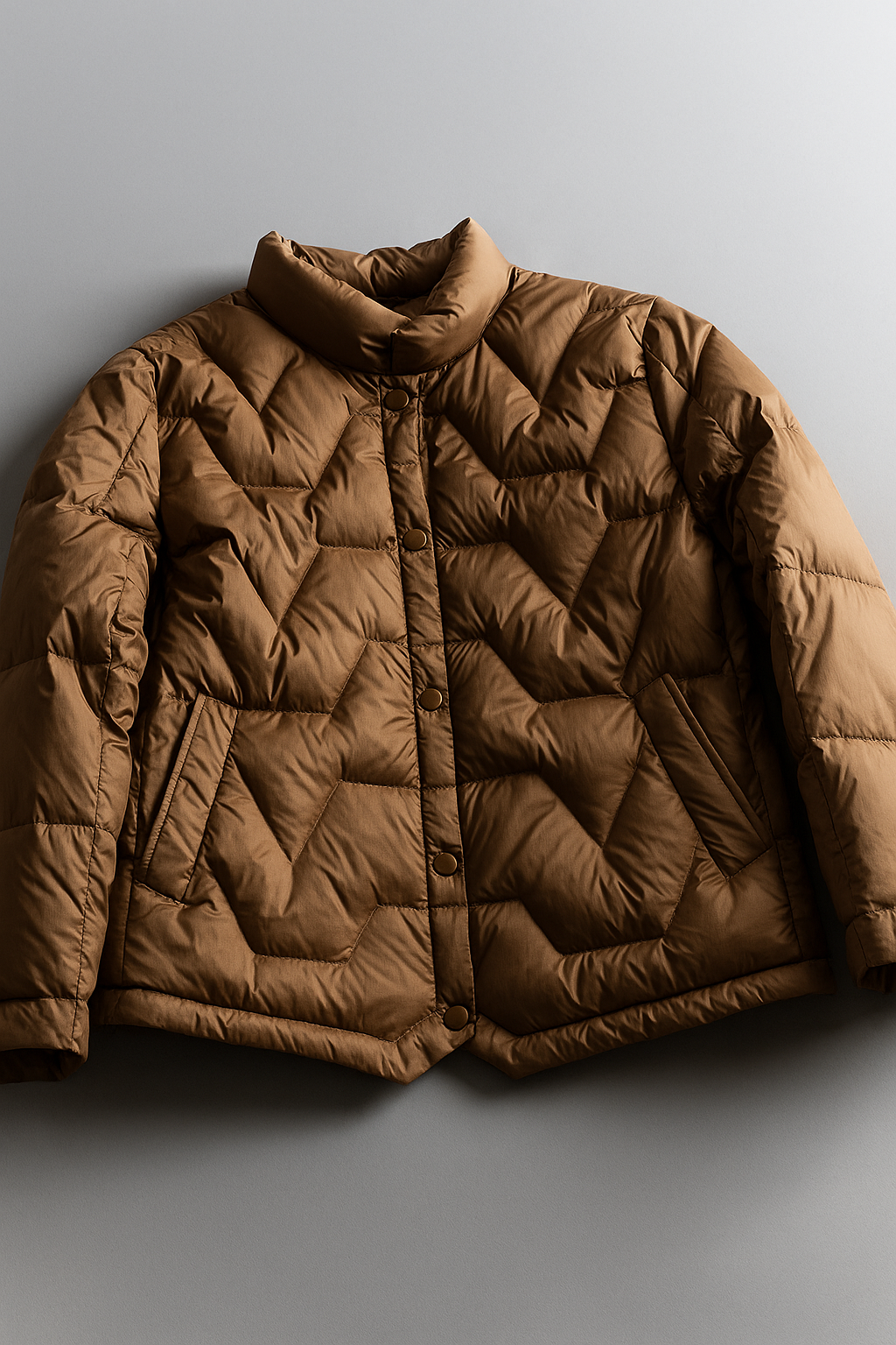 Women’s Aurora short quilted puffer jacket by Christine Brewer, stylish insulated outerwear with a quilted design and front zipper.
