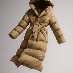 Long belted puffer jacket for women by Christine Brewer, featuring a stylish, insulated design with a belt and modern puffer style.