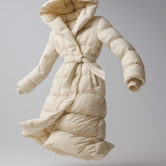 Ella long belted puffer jacket for women by Christine Brewer, warm winter jacket with belt and quilted design, black color.