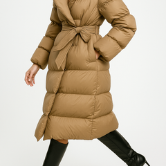 Elegant Ella long belted puffer jacket for women by Christine Brewer, shown in a stylish, insulated design with a belted waist.