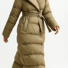 Elegant long belted puffer jacket for women by Christine Brewer, featuring a sleek design and warm quilted exterior.