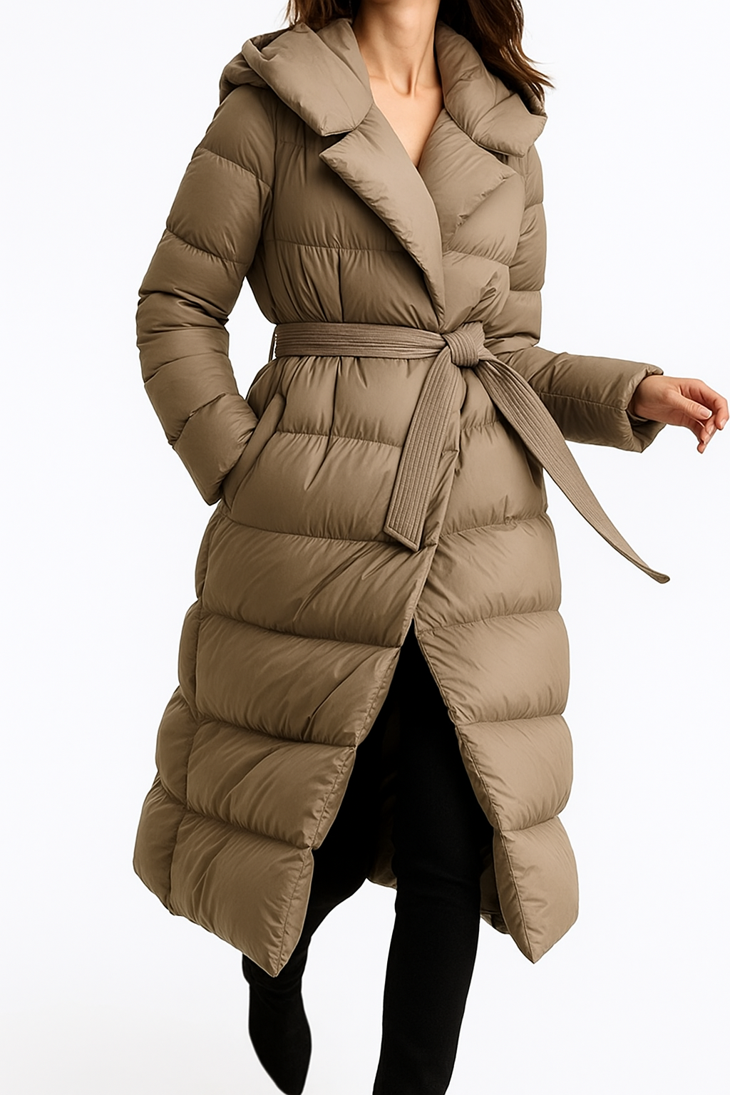 Long belted puffer jacket for women by Christine Brewer, featuring a stylish, quilted design and a waist belt for a chic look.