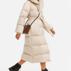 Ella long belted puffer jacket for women by Christine Brewer, stylish quilted winter coat with belt and hood.