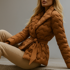 Brown Chloe belted quilted puffer jacket for women by Christine Brewer, displayed on a neutral background.