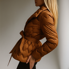 Brown Chloe belted quilted puffer jacket for women by Christine Brewer, featuring a quilted design and waist belt.