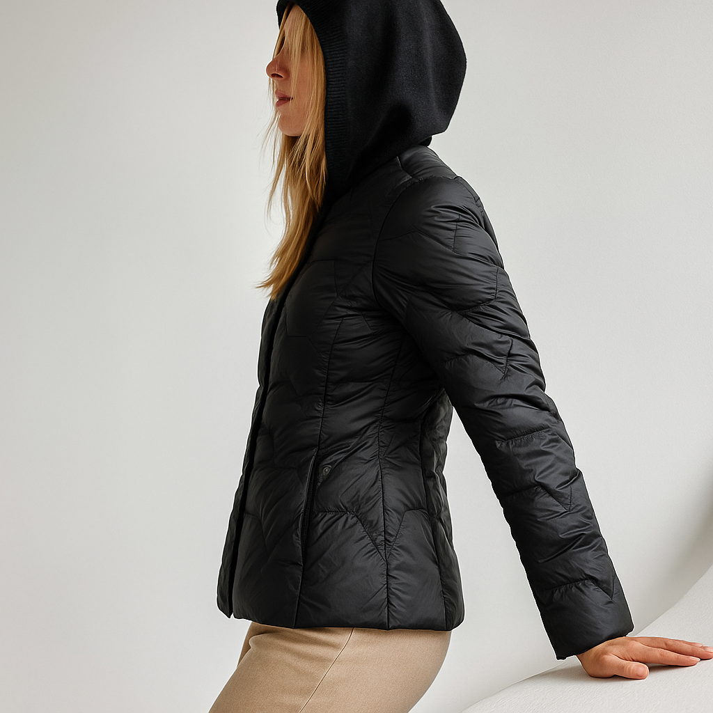 Black Zoe quilted puffer jacket for women with hood, by Christine Brewer, featuring a stylish quilted design and warmth.