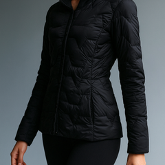 Black Zoe hooded quilted puffer jacket for women by Christine Brewer, featuring a cozy hood and quilted design.