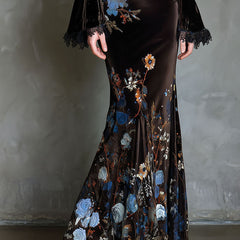 Velvet floral evening dress by Christine Brewer featuring elegant design, with intricate floral patterns and a sophisticated silhouette.