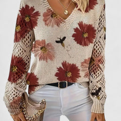 Women’s floral V-neck cardigan by Christine Brewer, featuring a colorful floral pattern and lightweight knit fabric.
