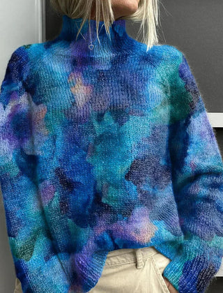 Lucy's ribbed turtleneck sweater for women by Christine Brewer, featuring a snug fit and cozy knit texture.