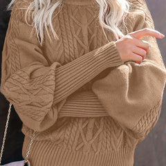 Christine Brewer Lauren women's knit sweater in cozy, textured fabric, shown in a close-up view of the sweater's neckline and sleeve.