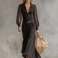 Black denim V-neck maxi dress by Christine Brewer, casual style with flowing length and sleeveless design, shown on a model.