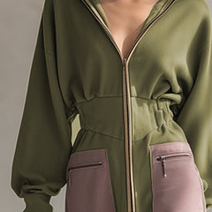 Green long sleeve maxi dress by Christine Brewer, elegant evening dress with flowing fabric and fitted waist.