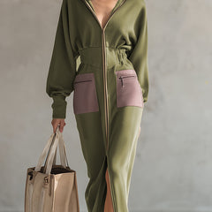 Green long sleeve maxi dress by Christine Brewer featuring a flowing evening dress style with elegant fabric and a fitted silhouette.