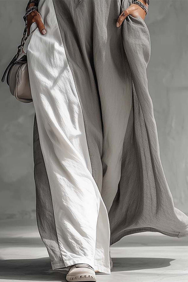 Color-blocked sleeveless maxi dress with round neck and casual pockets by Christine Brewer, featuring a loose fit and vibrant style.