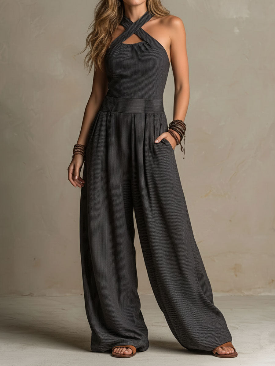 Charcoal pinstripe halter neck wide-leg jumpsuit for women by Christine Brewer, featuring a stylish halter top and flowing wide-leg pants.