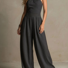 Charcoal pinstripe halter neck wide-leg jumpsuit for women by Christine Brewer, featuring a stylish halter top and flowing wide-leg pants.