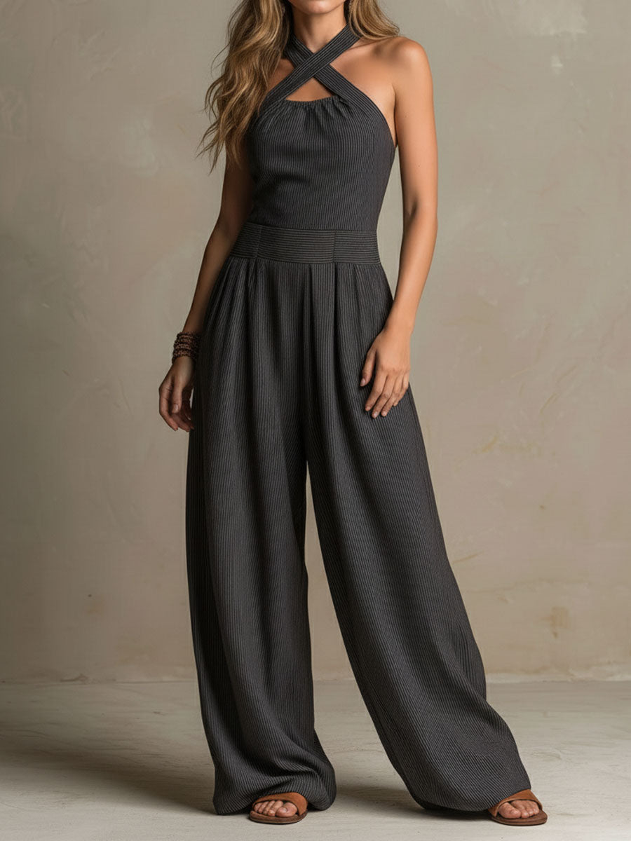 Charcoal pinstripe halter neck wide-leg jumpsuit for women by Christine Brewer, featuring a stylish halter top and flowing wide-leg pants.
