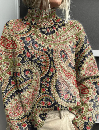 Christine Brewer Delaney women's turtleneck floral sweater featuring a colorful floral pattern and cozy knit fabric.