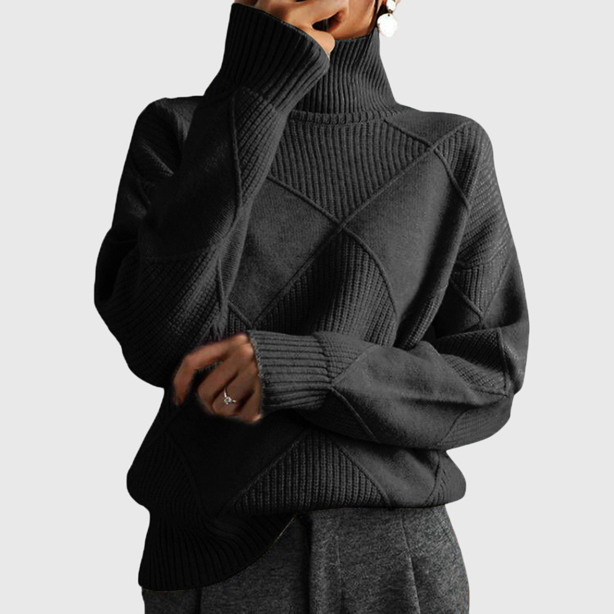Cream-colored Laura turtleneck sweater for women by Christine Brewer, featuring a cozy knit design and ribbed collar.