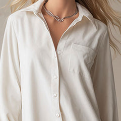 White denim ruffle midi dress by Christine Brewer featuring a fitted bodice and flowing skirt, perfect for evening wear.