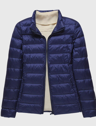Christine Brewer Lily ultra-light quilted jacket in soft fabric, displayed on a hanger with a subtle quilted pattern.