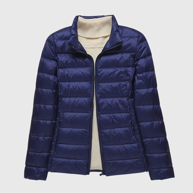 Christine Brewer Lily ultra-light quilted jacket in soft fabric, displayed on a hanger with a subtle quilted pattern.