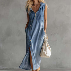 Blue denim V-neck midi dress by Christine Brewer, casual dress with a fitted waist and knee-length skirt, styled for everyday wear.