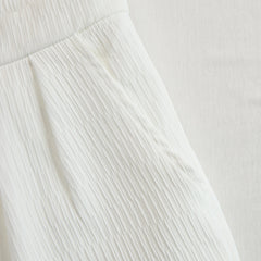 Cream textured lantern sleeve two-piece set for women by Christine Brewer, featuring stylish pants and a matching top.