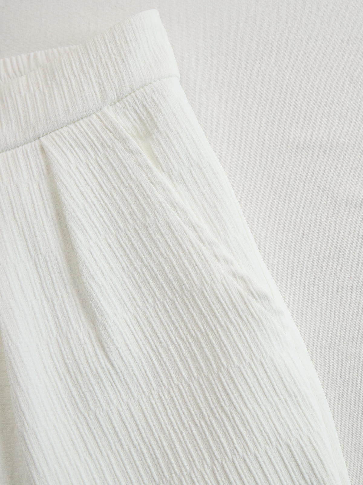Cream textured lantern sleeve two-piece set for women by Christine Brewer, featuring stylish pants and a matching top.