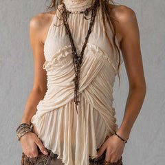 Ivory pleated halter neck chiffon blouse for women, sleeveless style with elegant pleats and a flattering fit.