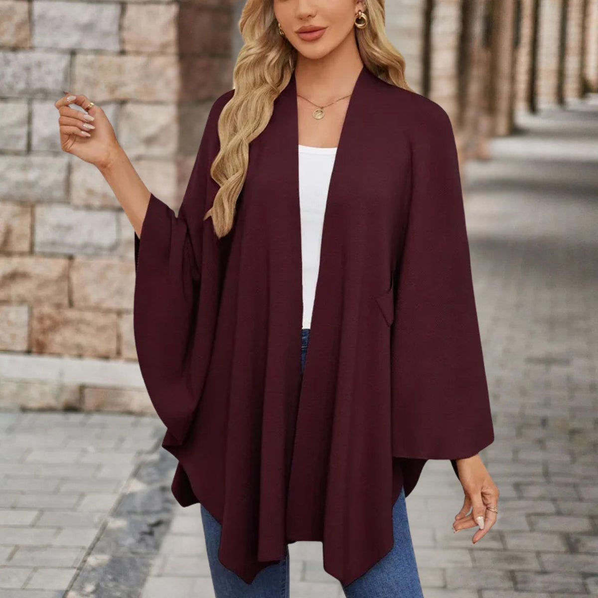 Christine Brewer Cecilia knit poncho for women, stylish and cozy top with a textured knit pattern, perfect for casual wear.