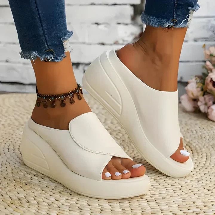 Eliza orthopedic slip-on wedge sandals for women by Christine Brewer, featuring comfortable design and supportive wedge heel.