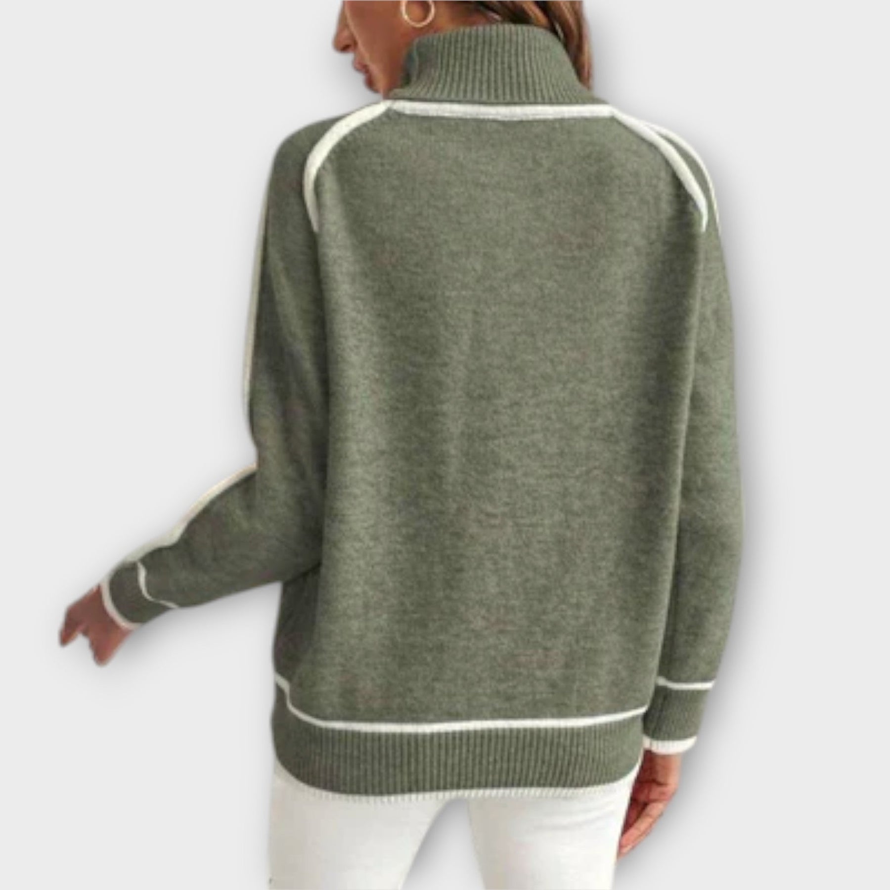 Christine Brewer Zoey green women's sweater, cozy knit sweater with long sleeves and ribbed cuffs, displayed on a model.