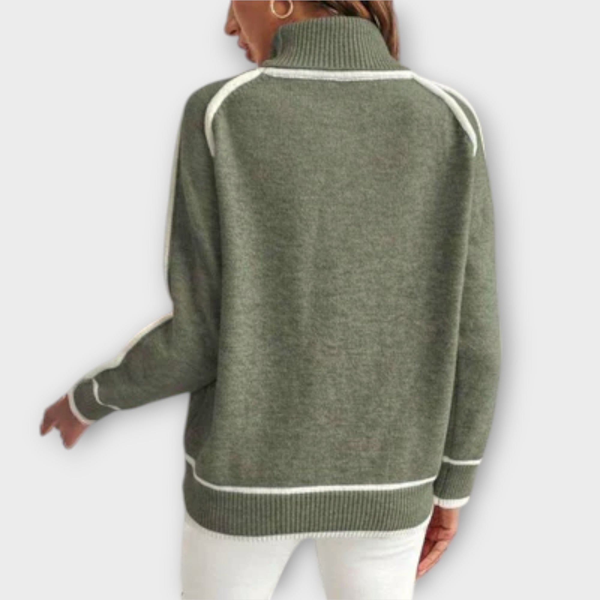Christine Brewer Zoey green women's sweater, cozy knit sweater with long sleeves and ribbed cuffs, displayed on a model.