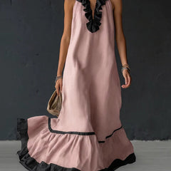 A-line loose maxi dress with contrast color pleats, ruffle trim, split-joint V-neck, by Christine Brewer, shown on a model.