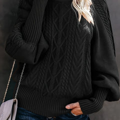 Woman wearing a beige knit sweater for women from Christine Brewer Lauren collection, featuring a cozy, textured design.