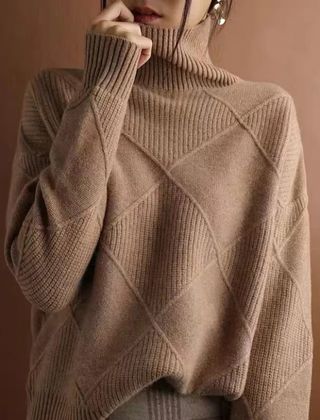 Cream-colored Laura turtleneck sweater for women by Christine Brewer, featuring a cozy knit and fitted design.