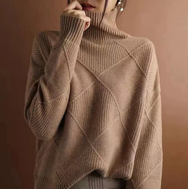 Cream-colored Laura turtleneck sweater for women by Christine Brewer, featuring a cozy knit and fitted design.