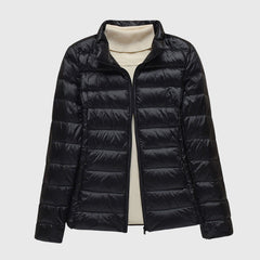 Christine Brewer Lily ultra-light quilted jacket shown, featuring a sleek design and lightweight insulation for stylish warmth.
