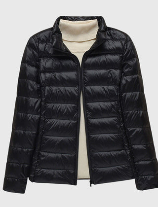 Christine Brewer Lily ultra-light quilted jacket shown, featuring a sleek design and lightweight insulation for stylish warmth.