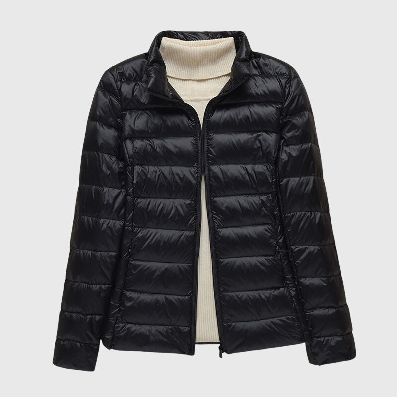 Christine Brewer Lily ultra-light quilted jacket shown, featuring a sleek design and lightweight insulation for stylish warmth.