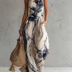 White ink wash print women's halter neck wide-leg jumpsuit with pockets, designed by Christine Brewer.