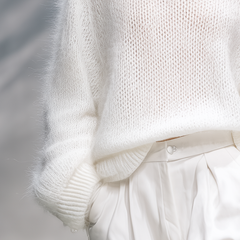 Christine Brewer elegant solid color round neck loose sweater, cozy knit pullover with relaxed fit and classic style.