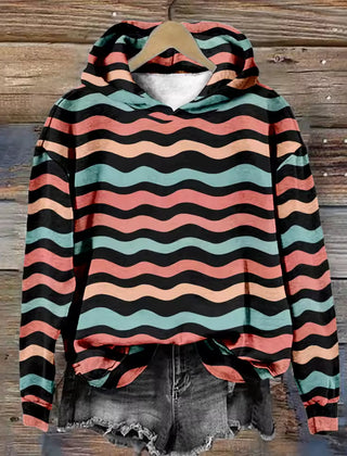 Amber Cozy Lightweight Oversized Soft Knit Hoodie by Christine Brewer, showing the relaxed fit and soft texture of the hoodie.