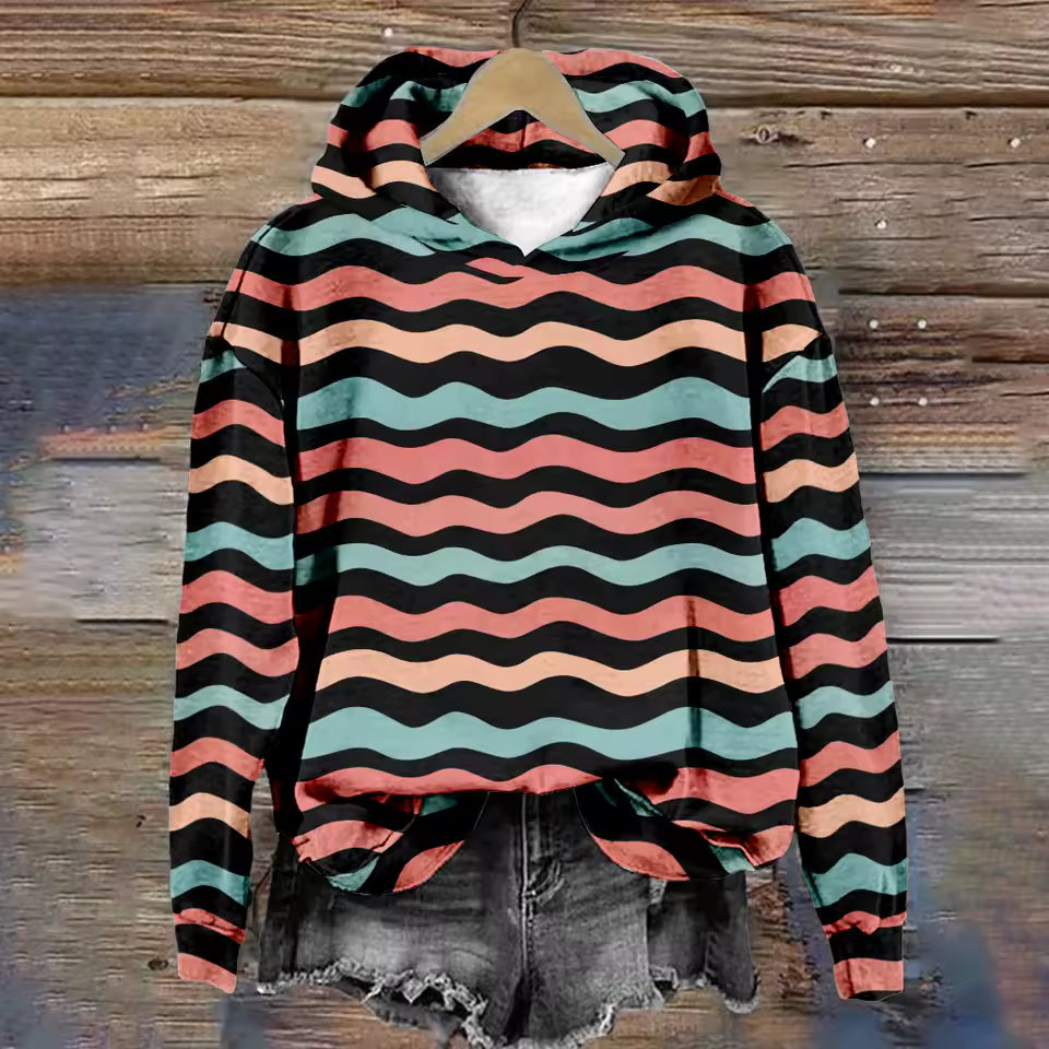Amber Cozy Lightweight Oversized Soft Knit Hoodie by Christine Brewer, showing the relaxed fit and soft texture of the hoodie.