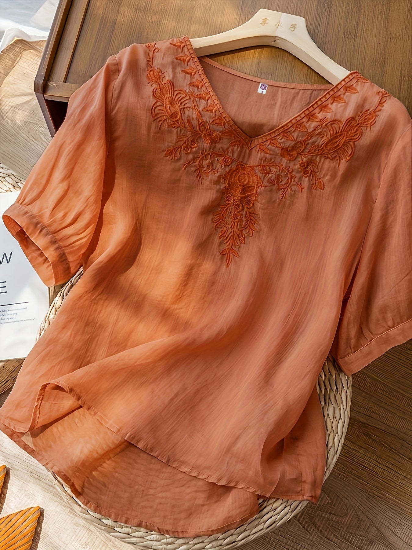 Light beige summer blouse for women by Christine Brewer featuring a V-neck and flowy linen fabric, casual and breathable top.