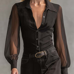 Black denim V-neck maxi dress by Christine Brewer featuring a casual style and flowing length, displayed on a hanger.