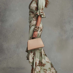 V-neck maxi dress for women by Christine Brewer, flowing fabric, sleeveless design, and elegant silhouette.