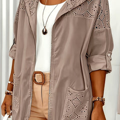 Women’s Iris hooded jacket by Christine Brewer, featuring a stylish, lightweight design with a hood and zipper closure.